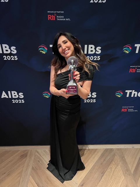 Haya Al Badarneh with an award at the AIBs 2025.